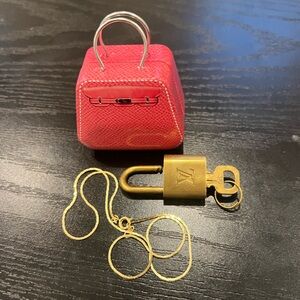 Louis Vuitton Gold Padlock with key #310 come with chain and mini handbag case